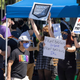 People supporting the Activision Blizzard employee walkout holding up signs.
